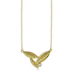 East Fourth Street Jewelry's 18kt Fairmined yellow gold and diamond pendant is the perfect size for a diamond Flora Leaf Pendant. Hand carved and cast in their Minnesota studio.