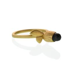 Hand-carved and Cast in recycled 14kt yellow gold, set with a Fair-trade black spinel gemstone