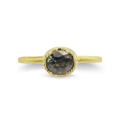 VINTAGE OVAL-CUT FORREST GREEN SAPPHIRE IN A STACKING GOLD RING WITH MILGRAIN EDGE
